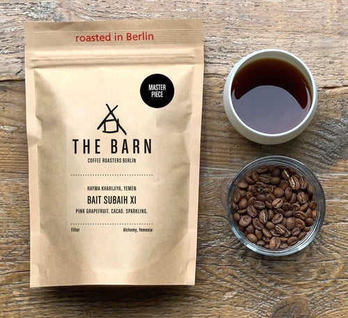 Bait Subaih XI, Yemen Masterpiece Coffee with a mug filled with freshly roasted coffee