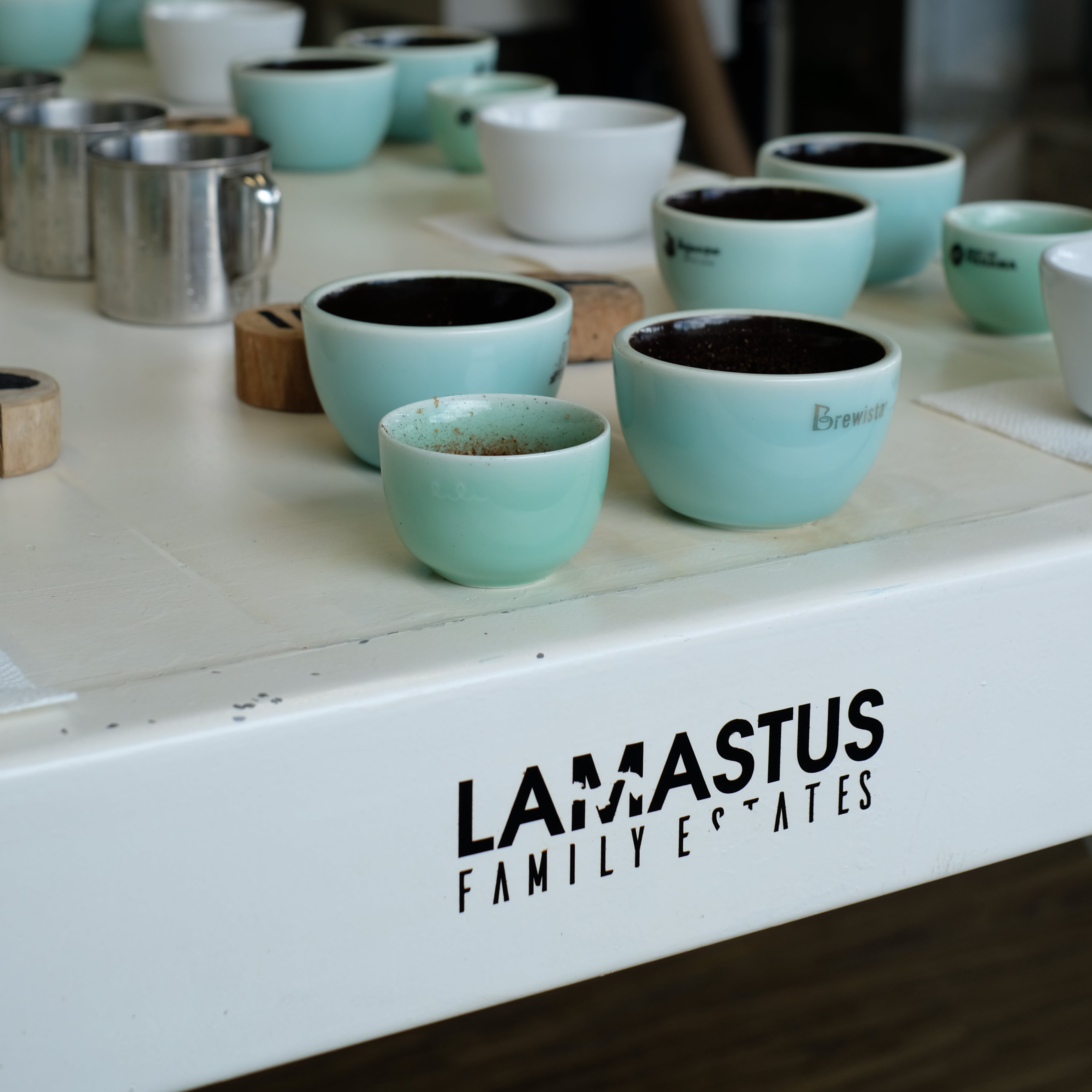 Coffee brewing equipment with 'Lamasius Family Estates' branding.